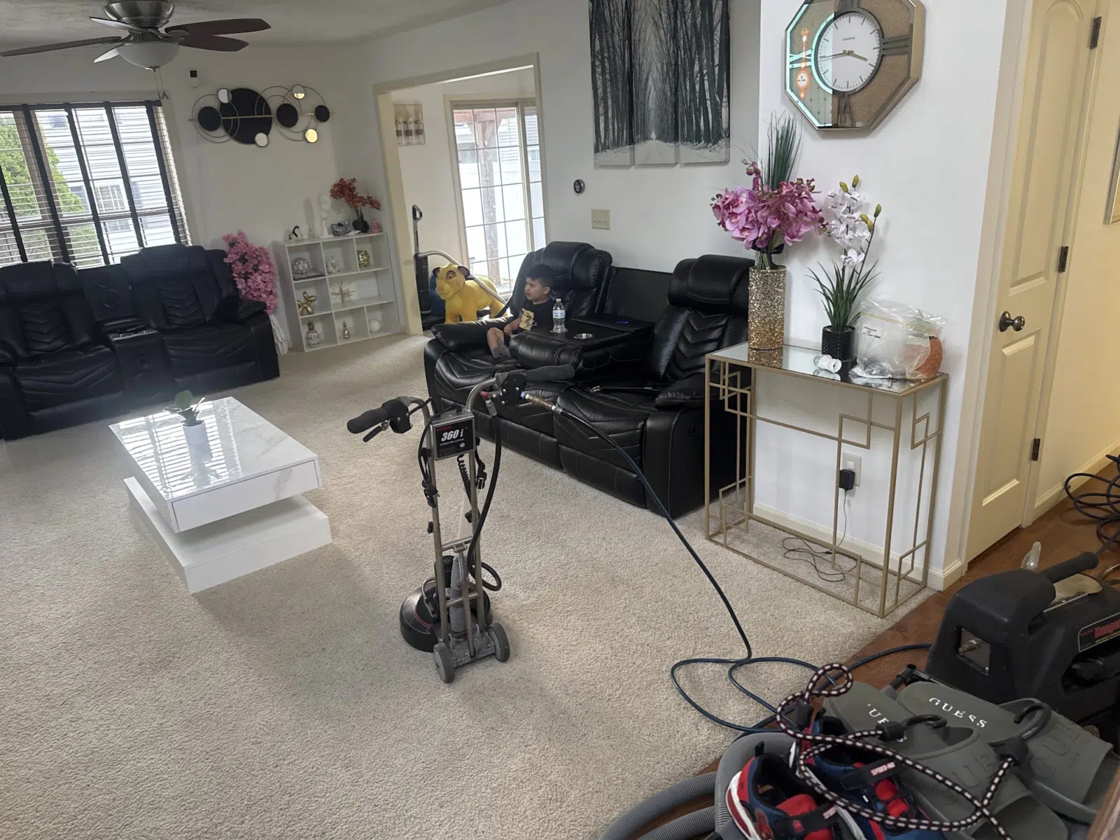 Carpet cleaning machine and hoses set up in a living room — Leskuin Cleaning LLC in Springfield